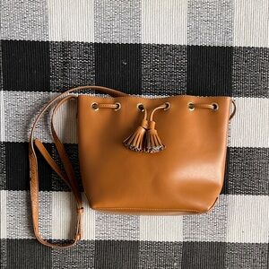 Brown bucket bag with tassel
